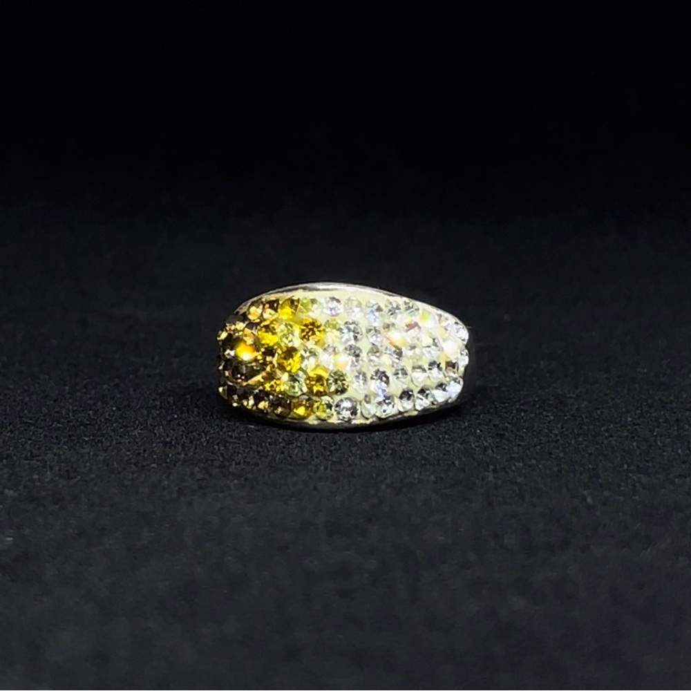 Sterling silver ring with yellow / white stones